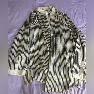 Size 2X but runs very large. Striped long sleeve blouse